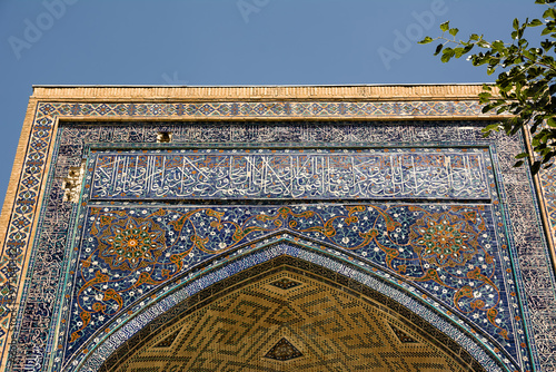 Detail with Arabic writings from the Koran at the entrance portal to a madrassa at the Registan in Samarkand