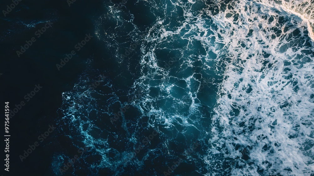 Fototapeta premium Dark blue water with white foam in the ocean.