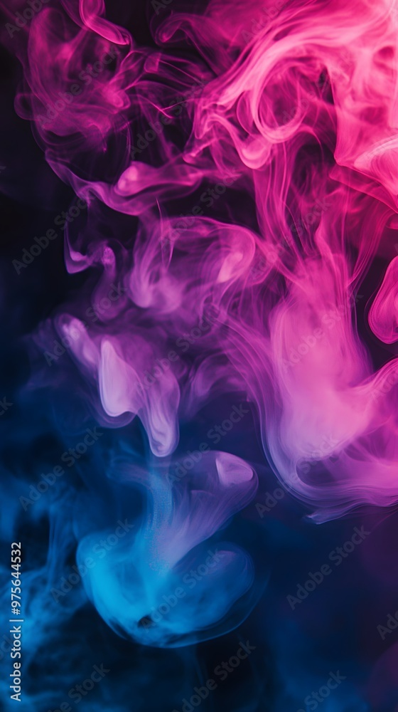 Fototapeta premium Abstract pink and blue smoke swirls against a dark background.