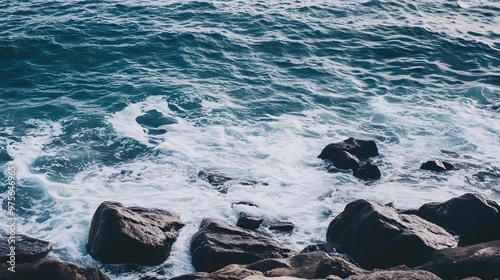 Ocean waves crashing against rocky shore.