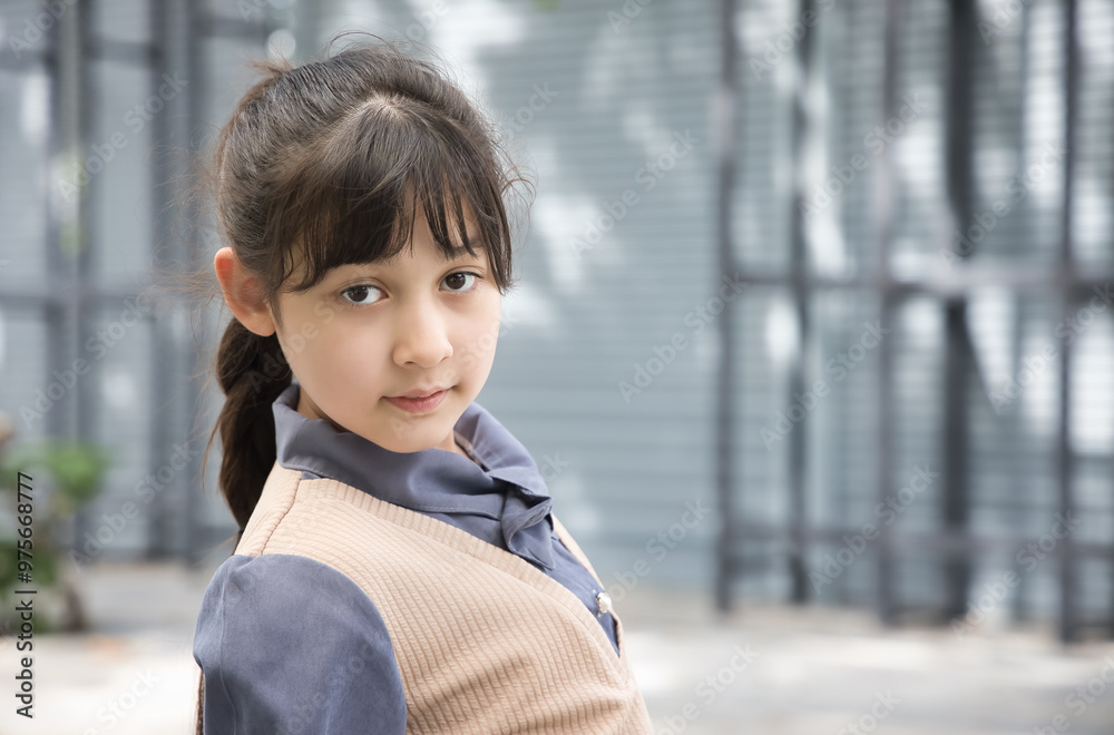 Sad and feeling down asian little primary school girl looking and thinking about something negative Sad and feeling down asian little primary school girl looking and thinking about something negative