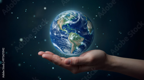 Hand holding planet Earth against a starry space background