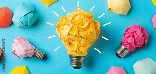 Crumpled paper light bulbs symbolize creativity and innovative thinking photo