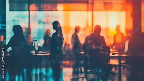 Diverse silhouettes collaborating in a blurred coworking space teamwork and cooperation concept