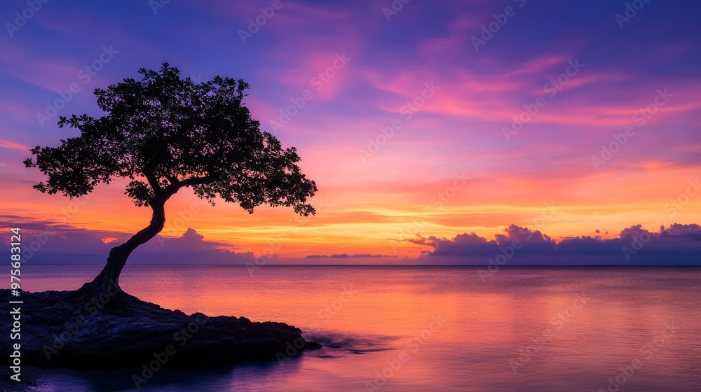 Silhouette of tree against stunning sunset over calm ocean, vibrant sky. Tranquility and nature concept Silhouette of tree against stunning sunset over calm ocean, vibrant sky. Tranquility and nature concept