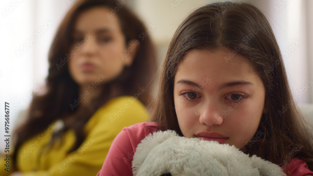 Upset scared sad Caucasian little girl sister crying child kid daughter cry hug toy family argue conflict quarrel blurred figure mad angry woman mother female parent domestic violence childcare indoor Upset scared sad Caucasian little girl sister crying child kid daughter cry hug toy family argue conflict quarrel blurred figure mad angry woman mother female parent domestic violence childcare indoor