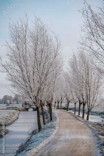 A frozen country road specific to rural Holland during a frosty winter. Walking path along the famous Dutch canals