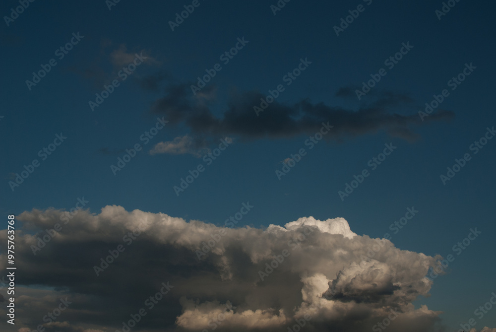 Gray and white clouds in the evening sky. Gray and white clouds in the evening sky.