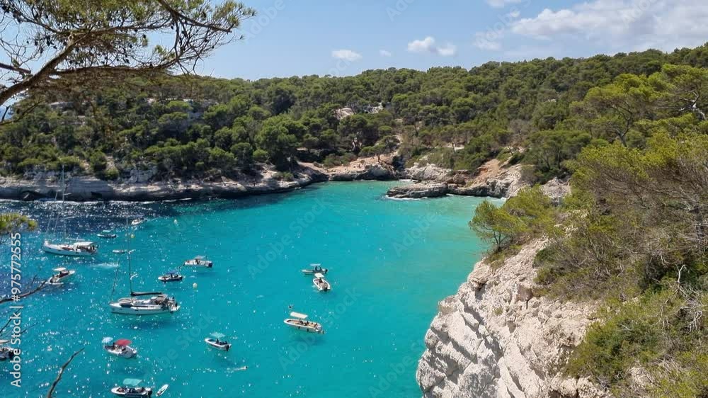 View of turquoise sea in beautiful bay Cala Mitjaneta in Menorca Spain View of turquoise sea in beautiful bay Cala Mitjaneta in Menorca Spain