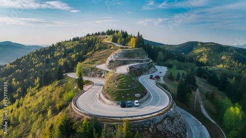 Aerial top view beautiful curve road on green forest in the summer season.