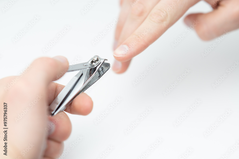 Close up of male hands cutting nails Close up of male hands cutting nails