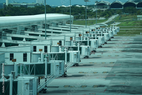 Canvas Print A row of jet bridges lined up at an airport near Kuala Lumpur.