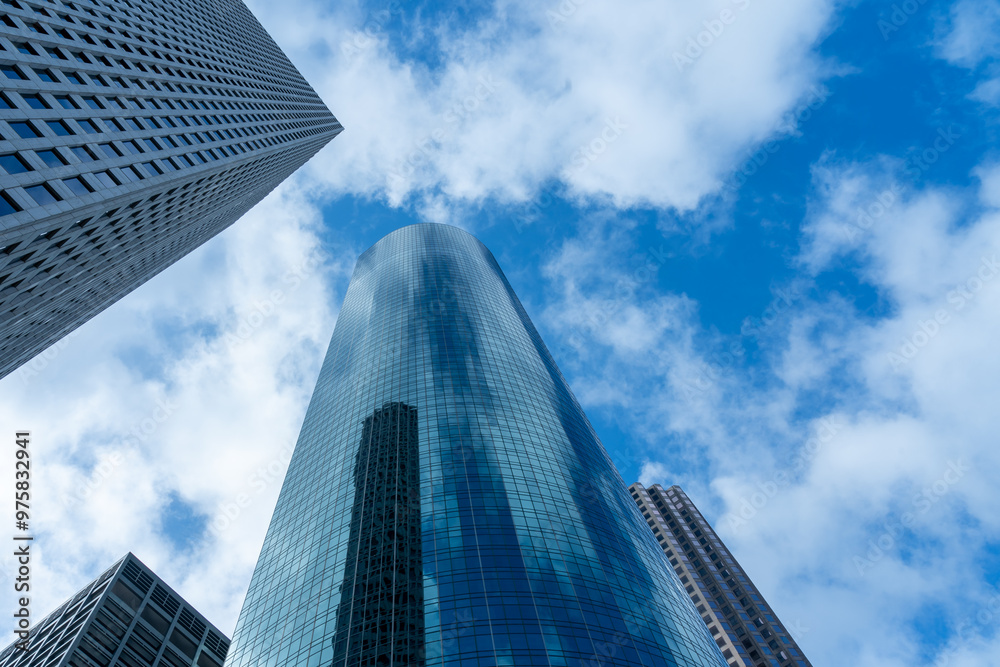 Looking Up modern high-rise office buildings with blue sky in the background. Looking Up modern high-rise office buildings with blue sky in the background.