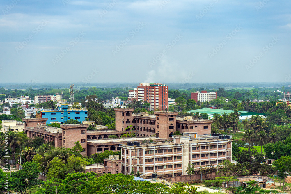 Urban landscape with dense development colorful buildings and lush greenery, showcasing the dense architectural layout of city, Rajshahi, Bangladesh.