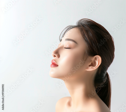 Radiant Close-Up of a Young Asian Woman's Face with Healthy Skin