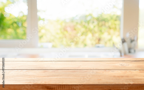 wooden table close up, against wall with warm sunset light from window, table for advertising display your products.