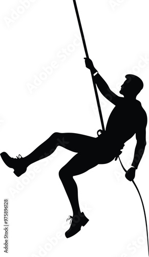 Silhouette of a Rock Climber Rappelling Down