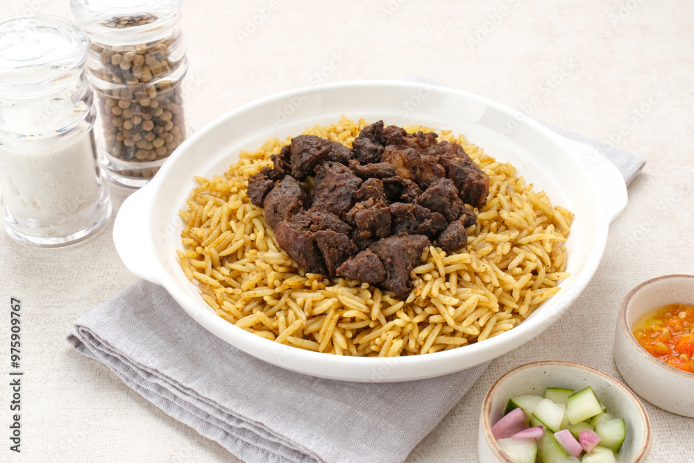 Nasi Kebuli Kambing, Arabian Rice with herb, spices and goat meat topping
Nasi Kebuli Kambing, Arabian Rice with herb, spices and goat meat topping