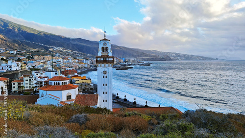 Candelaria cityscape with the Royal Basilica Marian Shrine of Our Lady of Candelaria in the foreground.  Our Lady of Candle is the patron of the Canary Islands. Santa Cruz de Tenerife, Spain, Europe.