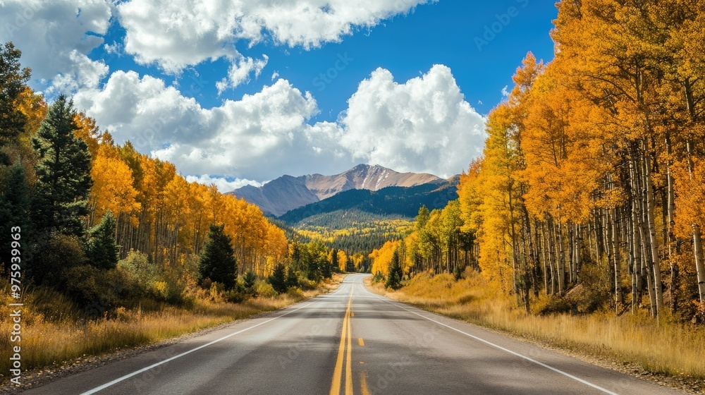 A scenic drive through the mountains with trees in full fall colors lining the road. A scenic drive through the mountains with trees in full fall colors lining the road.