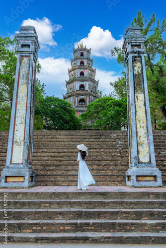 Asian woman visits Thien Mu Pagoda It is one of the ancient pagodas in Hue city. Near the Perfume River in the historic city of Hue, Vietnam. photo
