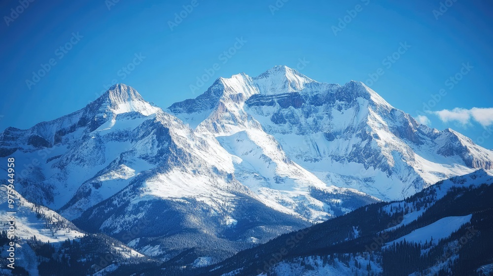 Snow-covered mountain peaks under a clear blue sky, with sunlight reflecting off the snow. Snow-covered mountain peaks under a clear blue sky, with sunlight reflecting off the snow.
