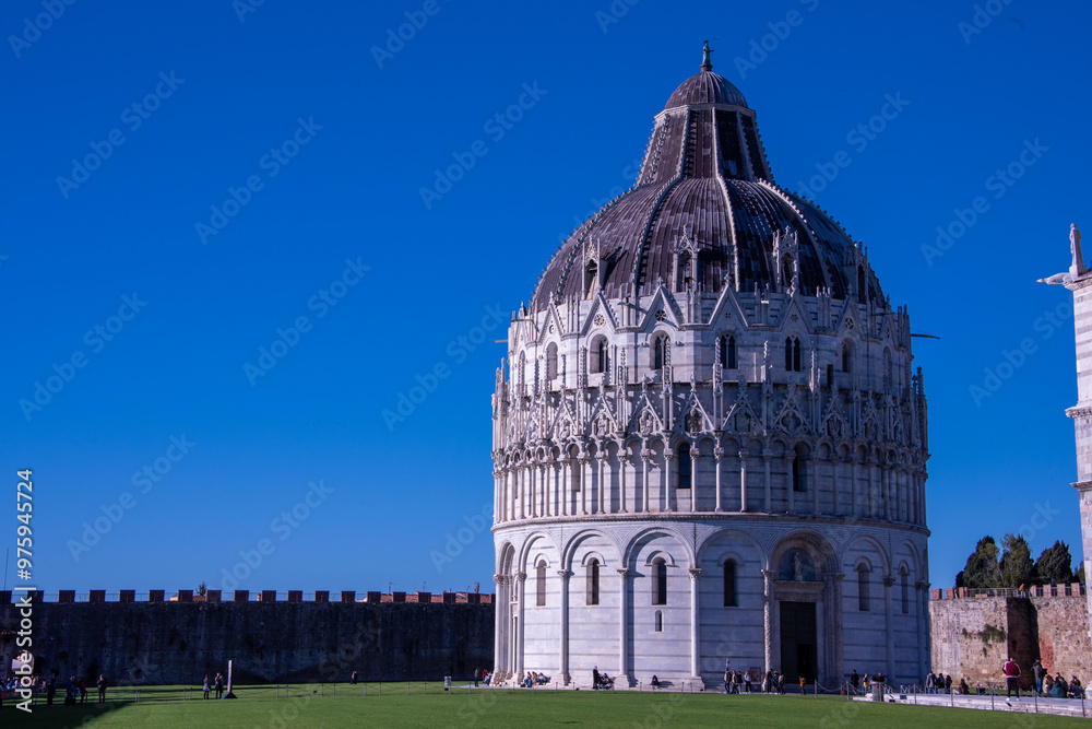 The Pisa Baptistery of St. John is a Roman Catholic ecclesiastical building located in the Piazza dei Miracoli, near the cathedral's and the famous leaning tower. The Pisa Baptistery of St. John is a Roman Catholic ecclesiastical building located in the Piazza dei Miracoli, near the cathedral's and the famous leaning tower.