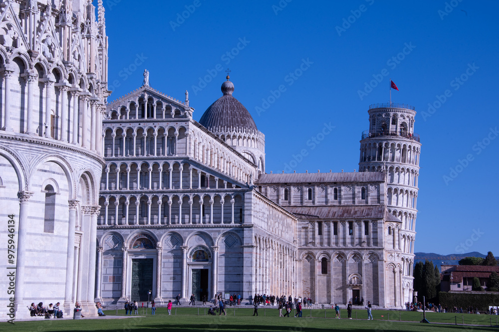 Obraz premium Piazza dei Miracoli, a breathtaking union of art, religion, and architecture, where Pisa's iconic Leaning Tower, Cathedral, Baptistery, and Camposanto stand as timeless symbols of medieval grandeur 