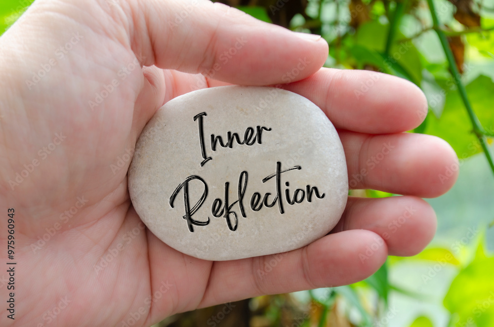 Inner Reflection text engraved on white stone. Motivational and inspirational concept Inner Reflection text engraved on white stone. Motivational and inspirational concept