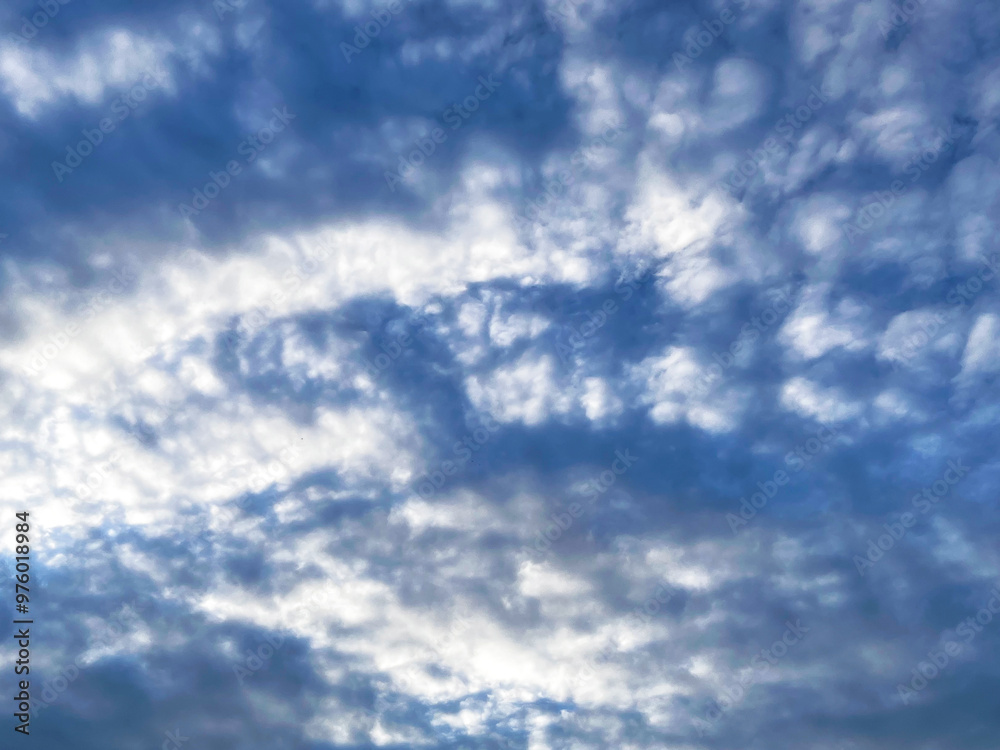 Fototapeta premium Beautiful view of blue sky with clouds at sunrise. Partly cloudy. Background cloud summer. Cloud summer. Sky cloud clear with sunset.