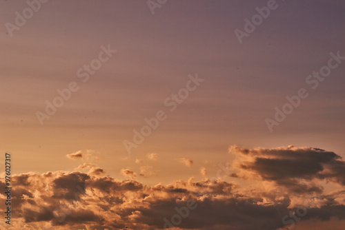 Serene Sunset Sky with Soft Clouds