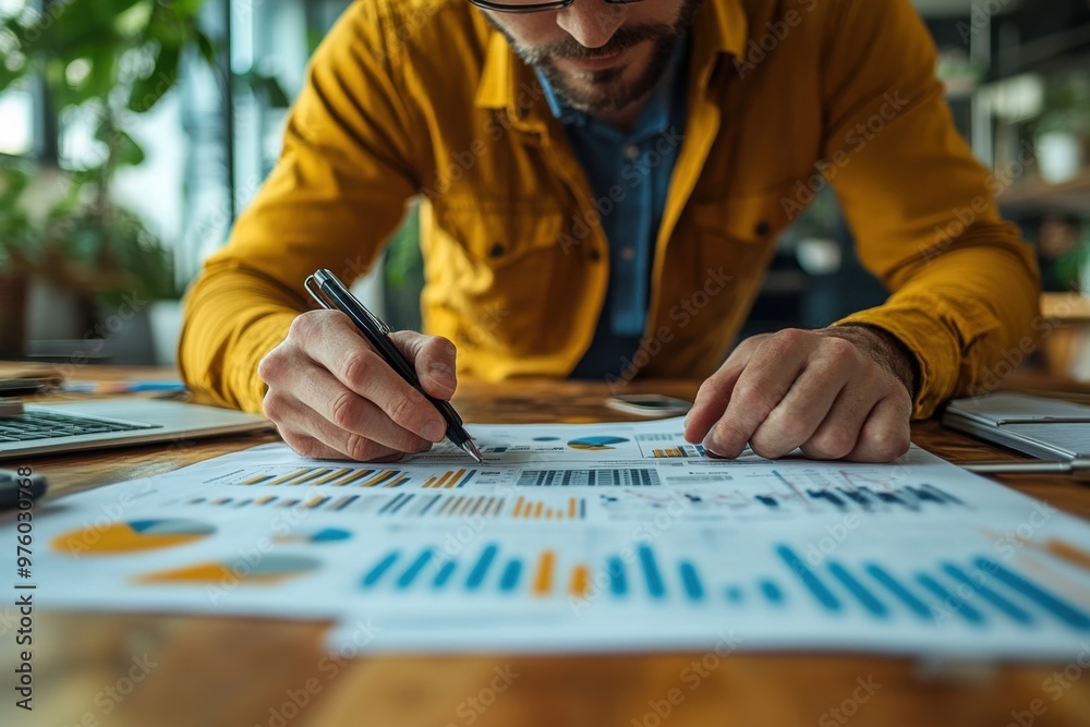 Man analyzing report paper of data of financial. Finance and investment concept. Man analyzing report paper of data of financial. Finance and investment concept.
