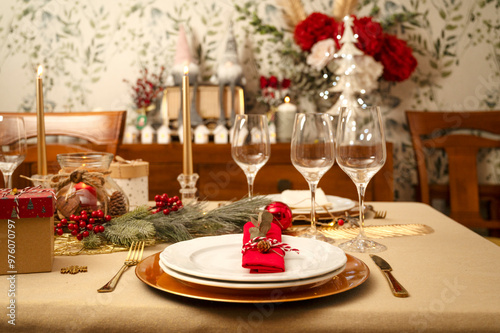 Elegant holiday table setting with festive decor and red accents, ready for a Christmas celebration