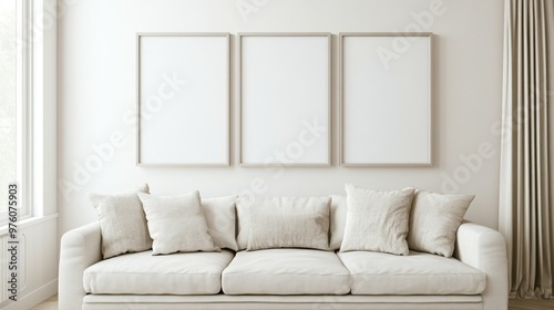 a mockup for wall art, clean white interior with beige tones, a couch against the wall, 3 portrait size frames on the wall, 