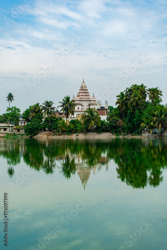 Obraz na płótnie Shiva Temple view from Shyam Sarobar lake, at Puthia Rajbari complex view from the pond, in Puthia, Bangladesh. Pancha Ratna Shiva Temple. w salonie