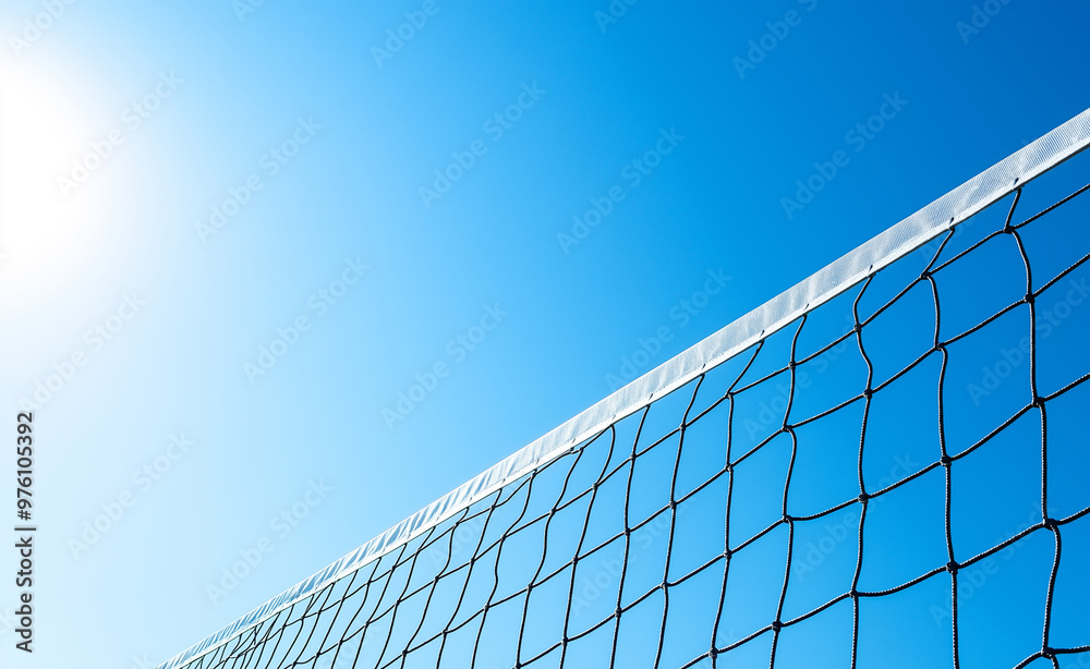 A volleyball net stretches across a bright blue sky, symbolizing outdoor sports and summer activities. A volleyball net stretches across a bright blue sky, symbolizing outdoor sports and summer activities.