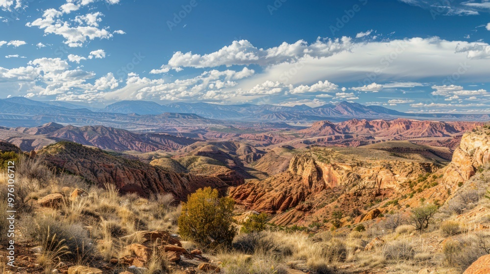 A scenic view of the Utah Mountains with rugged terrain and canyons A scenic view of the Utah Mountains with rugged terrain and canyons