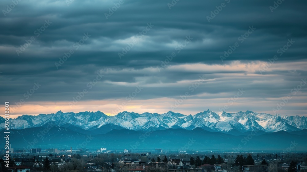 A view of the Denver Mountains with the city of Denver in the foreground A view of the Denver Mountains with the city of Denver in the foreground