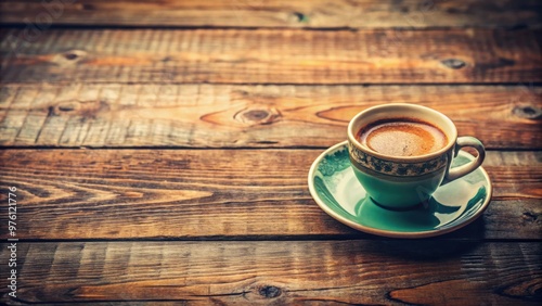 Vintage coffee cup on rustic wooden table with a nostalgic filter