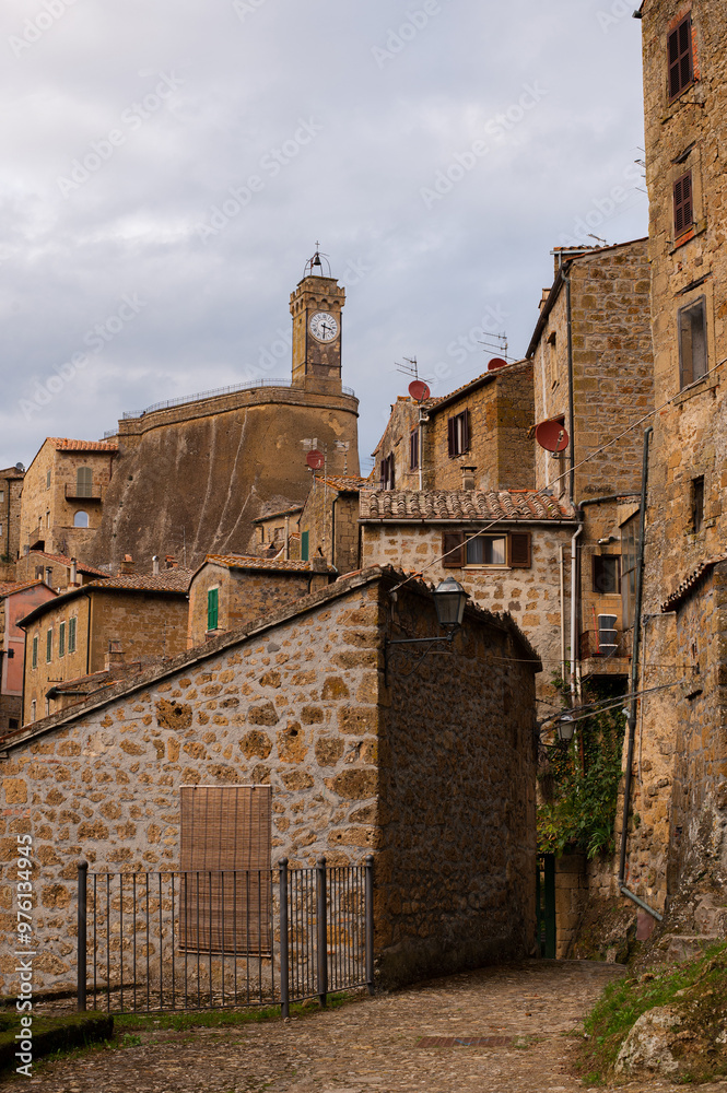 View of narrow streets of an ancient hill town Sorano. Etruscan town. Province Grosseto, Tuscany, Italy. View of narrow streets of an ancient hill town Sorano. Etruscan town. Province Grosseto, Tuscany, Italy.
