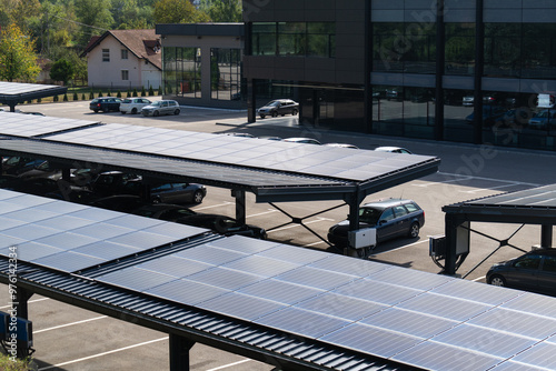 Fototapeta Naklejka Na Ścianę i Meble -  Parking space with solar panels on a roof
