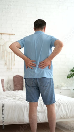 Back pain, kidney inflammation, man suffering from backache at home, health problems concept