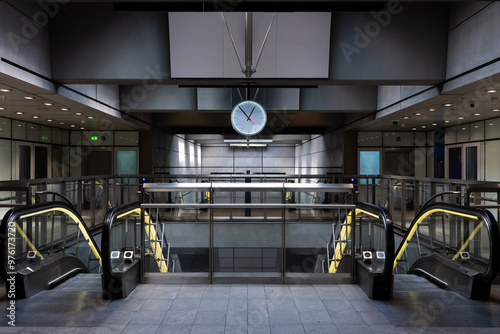 Photography Subway station entrance with a big clock, escalators steel stair, futuristic metal design