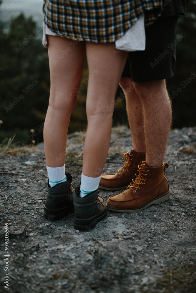 Couple in love embracing at sunset, feet close-up. Couple in love embracing at sunset, feet close-up.