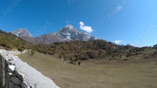 Panoramic view by Namche Bazar village in Nepal of mountain valley with mountains Everest, Lhotse, Kangtega and Khumbu Yui Lha in the background in a sunny spring day. Landscapes theme.Panoramic view 