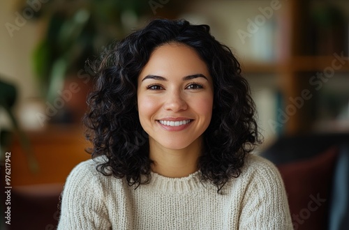 Beautiful smiling hispanic woman posing at home