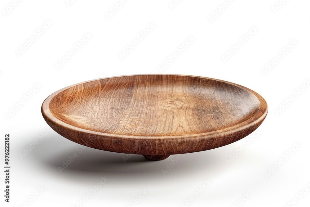 A wooden bowl placed on a table surface A wooden bowl placed on a table surface