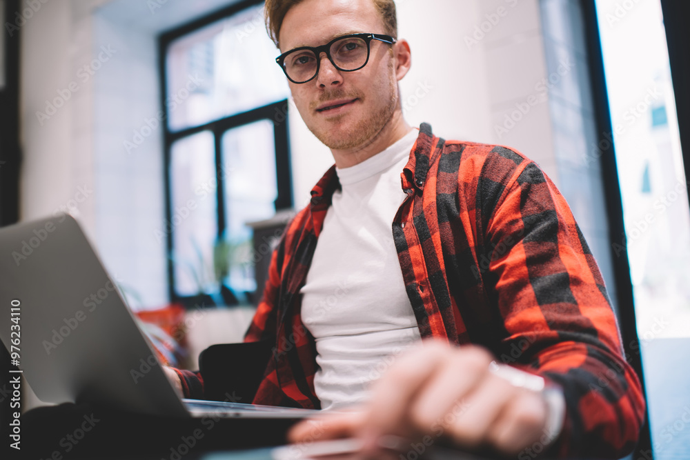 Young freelancer using devices for work Young freelancer using devices for work