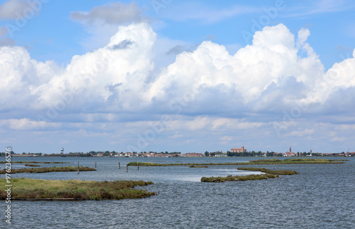 town of Valli Di Comacchio a renowned fishing location and the lagoon with the sea and the clouds above