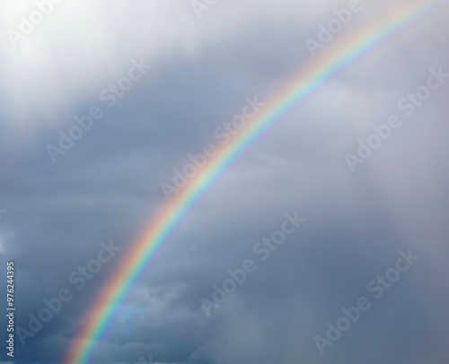 rainbow arch in the sky after the storm and it is a sign of good luck and good fortune